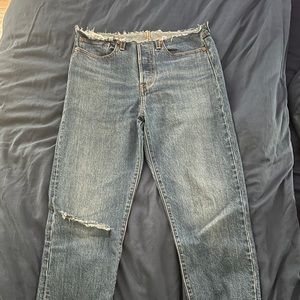 Bandless Levi’s with rips